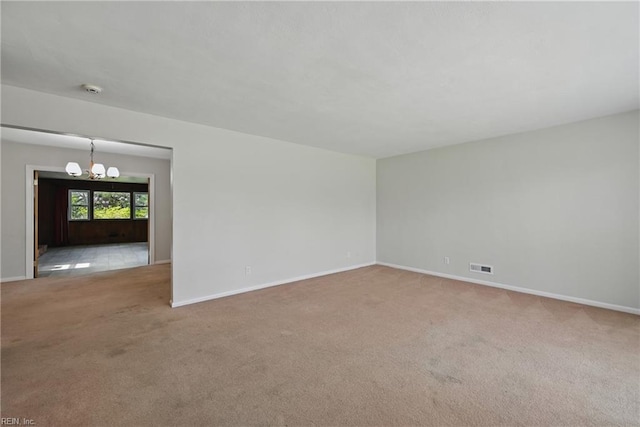 8084 Lynnbrook Dr, Norfolk, VA 23518 - carpeted empty room featuring a chandelier, baseboards, and a smoke detector