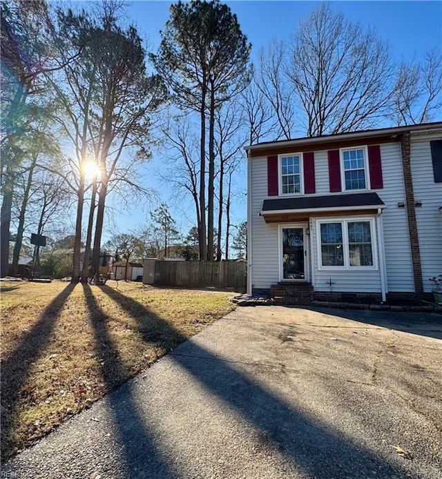 view of front of house featuring fence