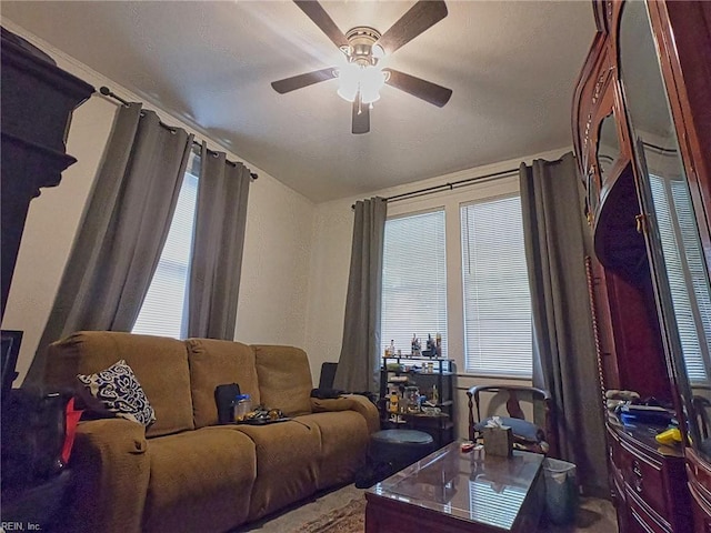 living room with a ceiling fan