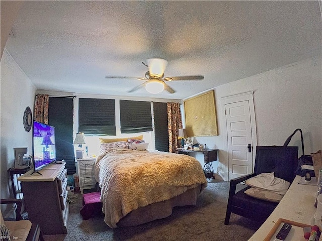 bedroom with carpet, ceiling fan, and a textured ceiling