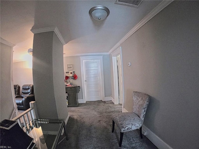 hall featuring crown molding, carpet, baseboards, and visible vents