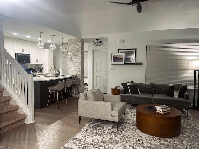 living area with recessed lighting, wood finished floors, stairway, and a ceiling fan