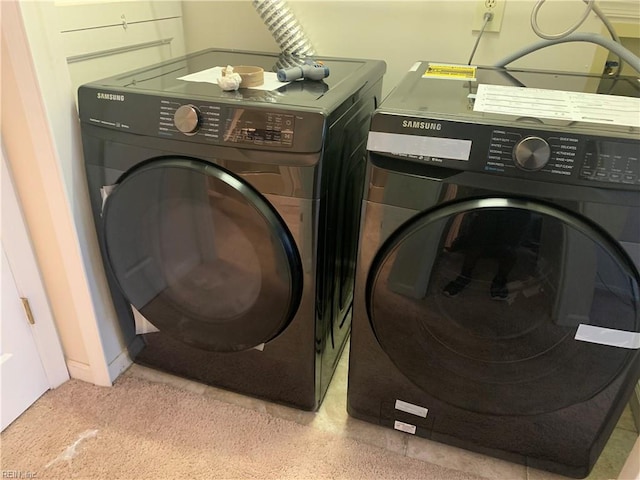 washroom featuring independent washer and dryer and laundry area