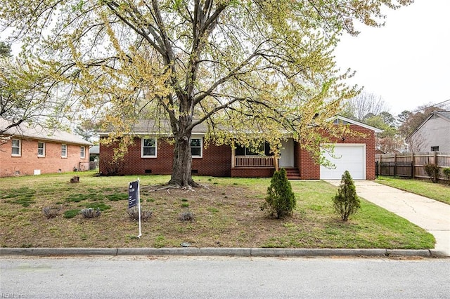 single story home with fence, an attached garage, a front yard, brick siding, and driveway
