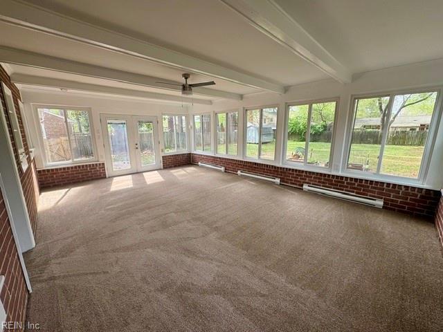 97 Waterview Dr, Newport News, VA 23608 - unfurnished sunroom featuring plenty of natural light, baseboard heating, beam ceiling, and brick wall