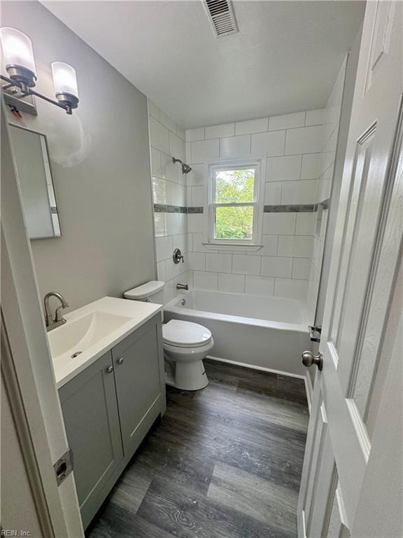 97 Waterview Dr, Newport News, VA 23608 - bathroom with vanity, toilet, visible vents, shower / bathtub combination, and wood finished floors