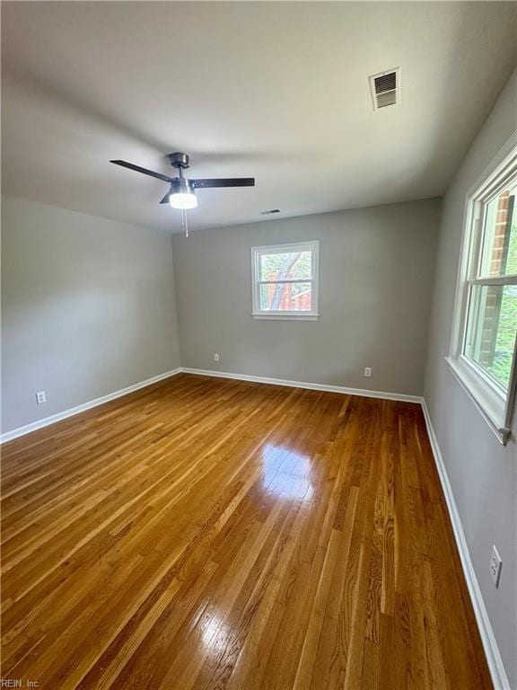 97 Waterview Dr, Newport News, VA 23608 - unfurnished room featuring hardwood / wood-style floors, plenty of natural light, baseboards, and visible vents