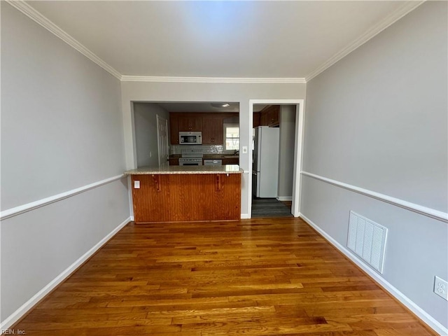97 Waterview Dr, Newport News, VA 23608 - kitchen with visible vents, a peninsula, baseboards, dark wood finished floors, and appliances with stainless steel finishes