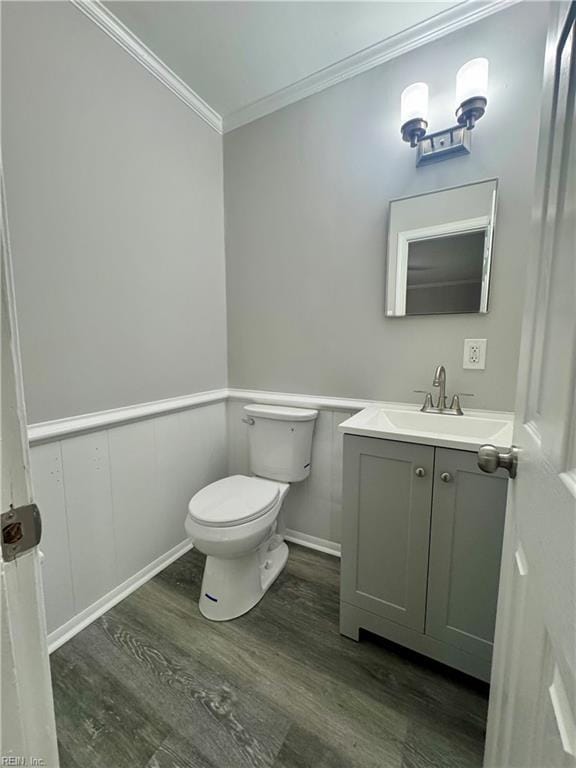 97 Waterview Dr, Newport News, VA 23608 - bathroom with ornamental molding, wood finished floors, toilet, vanity, and wainscoting