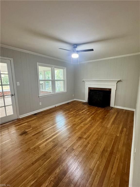 97 Waterview Dr, Newport News, VA 23608 - unfurnished living room featuring wood finished floors, a brick fireplace, baseboards, ceiling fan, and ornamental molding