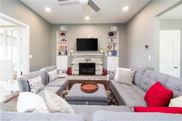 living area featuring visible vents, ceiling fan, recessed lighting, and a fireplace