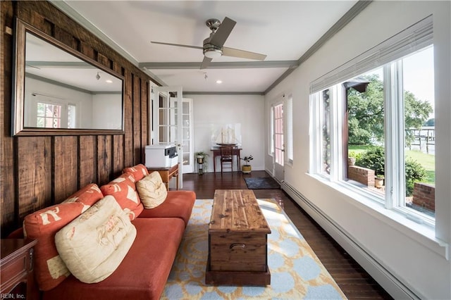 sunroom with a wealth of natural light and baseboard heating