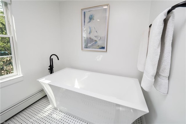 full bathroom featuring baseboard heating and a soaking tub
