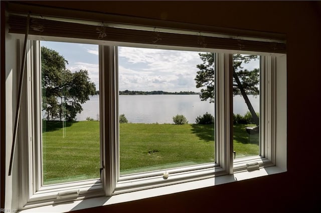 doorway with a healthy amount of sunlight and a water view