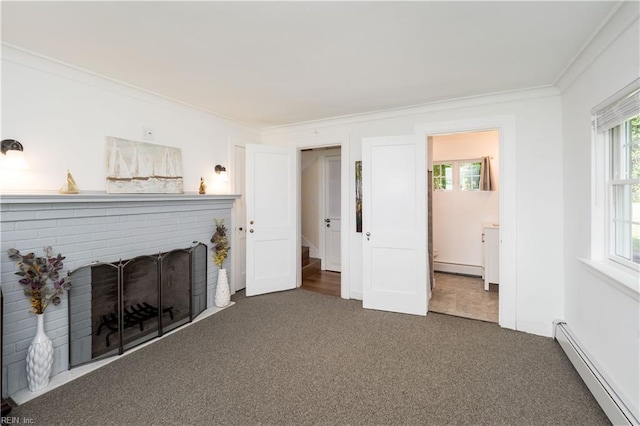 unfurnished living room with ornamental molding, carpet flooring, a baseboard heating unit, and baseboard heating