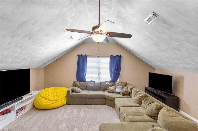 living area featuring a textured ceiling, a ceiling fan, and visible vents