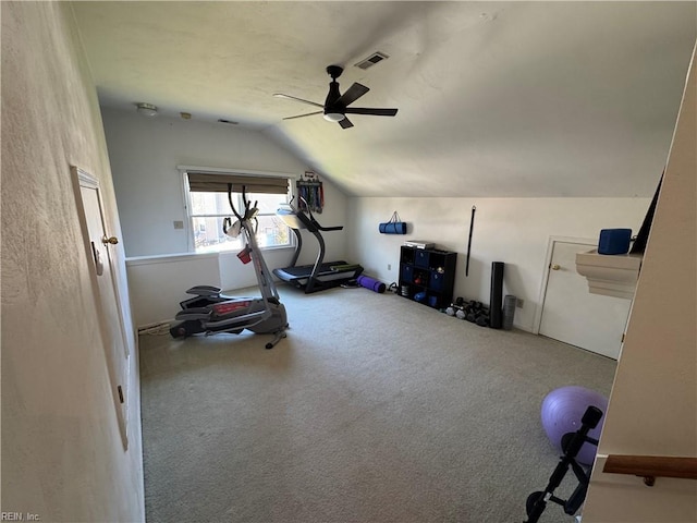 exercise room with visible vents, ceiling fan, vaulted ceiling, and carpet floors