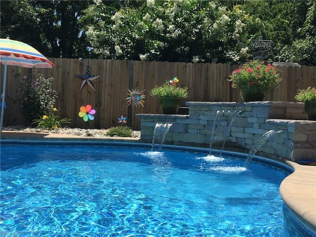 view of pool featuring a fenced backyard and a fenced in pool