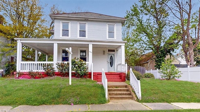 farmhouse-style home with fence, covered porch, and a front lawn