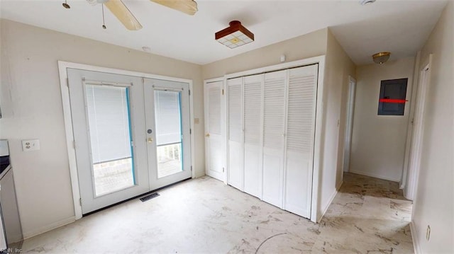 unfurnished bedroom featuring a ceiling fan, french doors, visible vents, baseboards, and access to outside