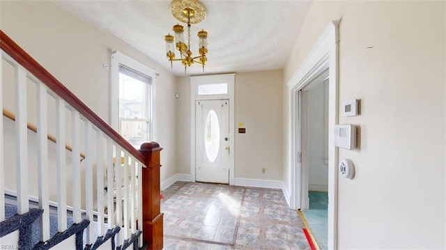 entrance foyer with a notable chandelier and stairway