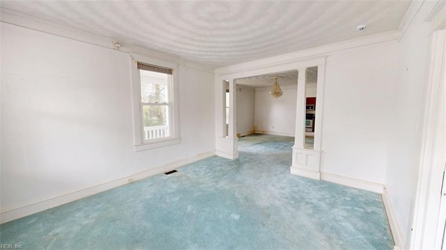 spare room featuring baseboards, carpet, and visible vents