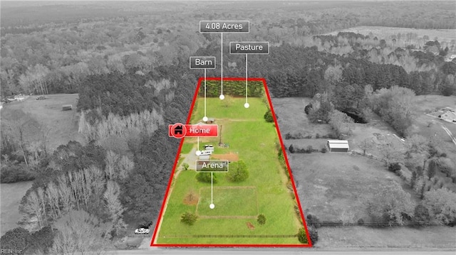 drone / aerial view with a wooded view