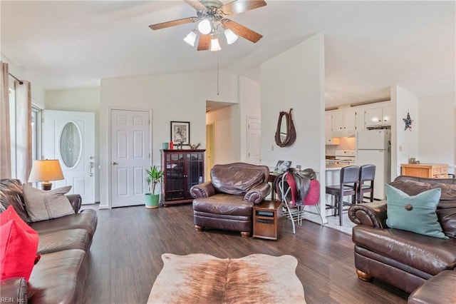 living room featuring dark wood-style flooring, vaulted ceiling, and ceiling fan