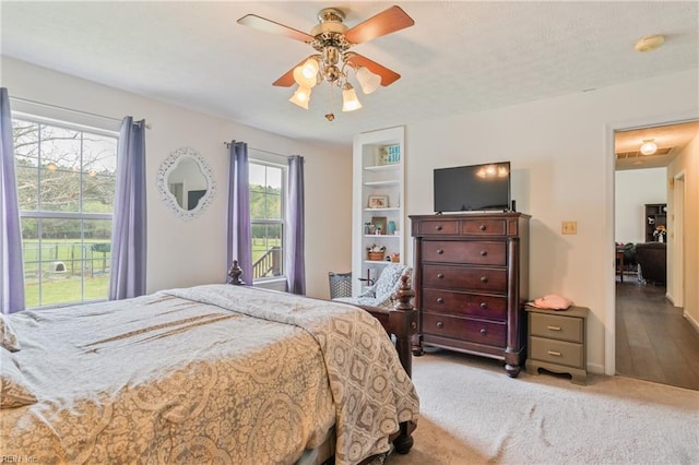 bedroom featuring carpet and a ceiling fan