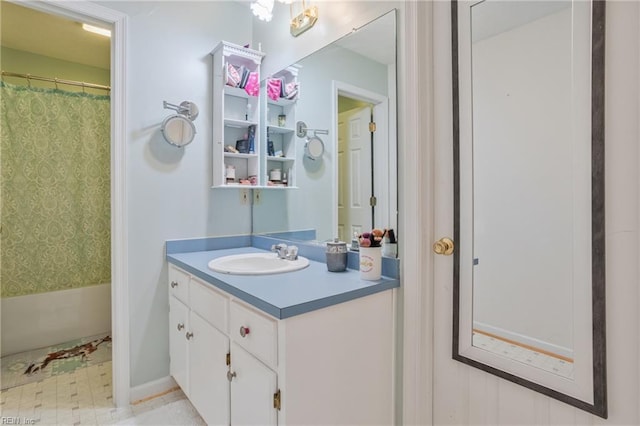 bathroom with shower / tub combo with curtain and vanity