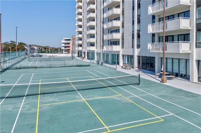 view of sport court with fence