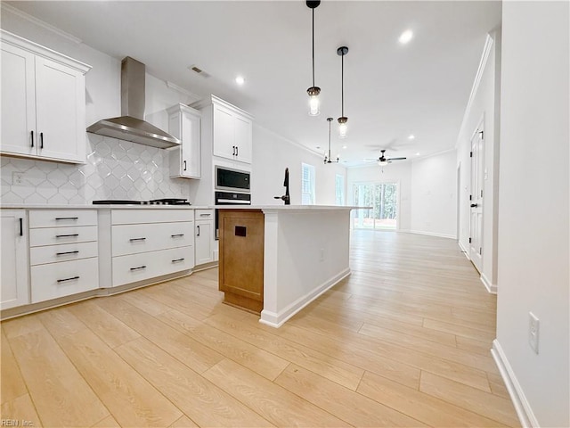 1541 Waltham Ln, Newport News, VA 23608 - kitchen featuring wall chimney range hood, built in microwave, cooktop, light wood-style flooring, and decorative backsplash