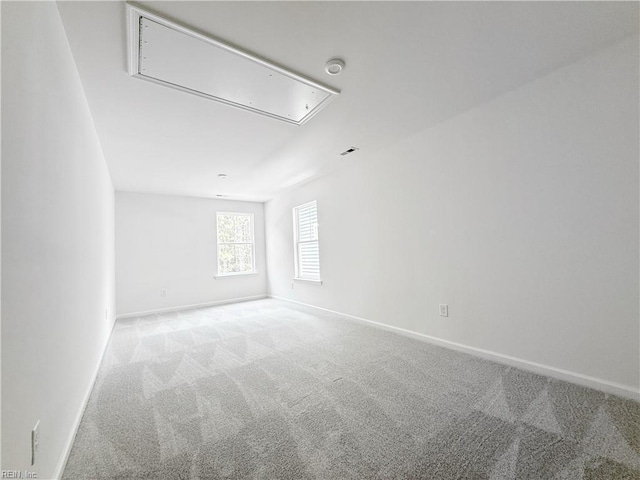 1541 Waltham Ln, Newport News, VA 23608 - empty room featuring attic access, carpet floors, and a smoke detector