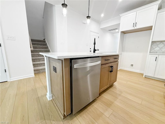 1541 Waltham Ln, Newport News, VA 23608 - kitchen with dishwasher, light wood-style flooring, light countertops, a kitchen island with sink, and pendant lighting