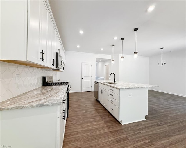 1539 Waltham Ln, Newport News, VA 23608 - kitchen featuring stainless steel appliances, white cabinets, backsplash, a kitchen island with sink, and dark wood-style flooring