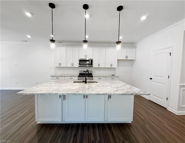 1539 Waltham Ln, Newport News, VA 23608 - kitchen with stainless steel appliances, white cabinetry, an island with sink, dark wood-type flooring, and tasteful backsplash