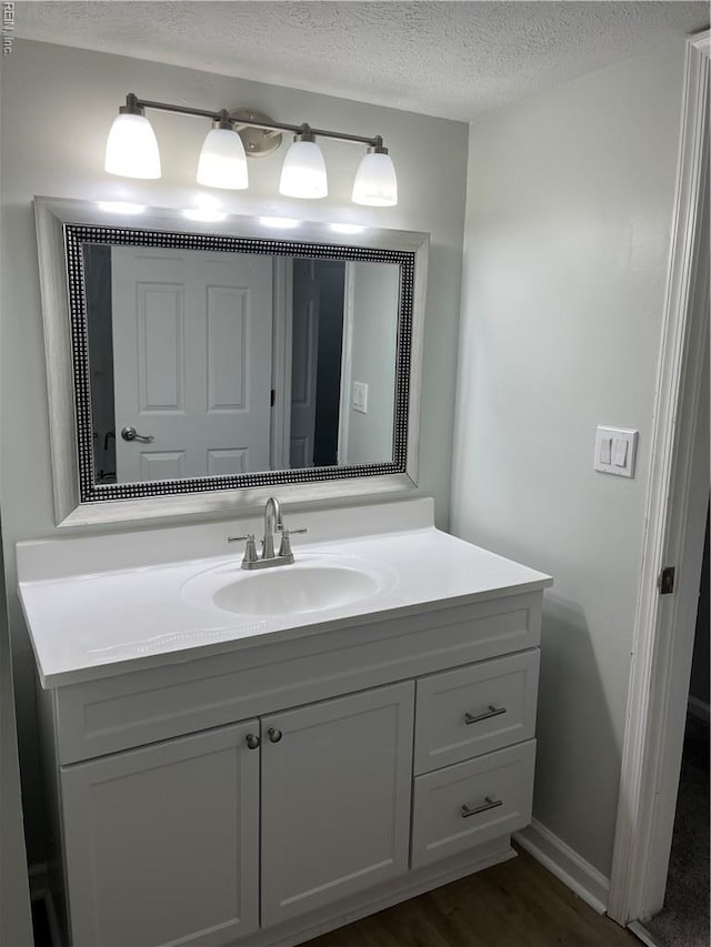 161 Haverford Ct Unit 2, Hampton, VA 23666 - bathroom featuring vanity, a textured ceiling, and wood finished floors