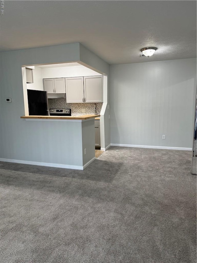 161 Haverford Ct Unit 2, Hampton, VA 23666 - kitchen with black refrigerator, stainless steel electric stove, carpet flooring, baseboards, and decorative backsplash