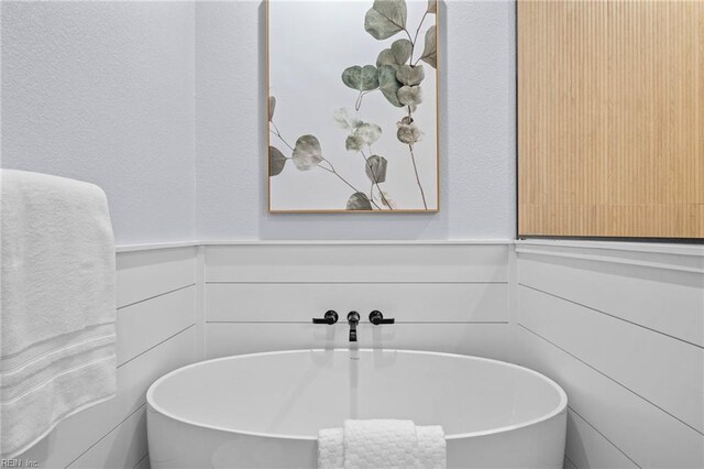 3545 Winston Ave, Virginia Beach, VA 23456 - full bathroom with a freestanding tub and a wainscoted wall