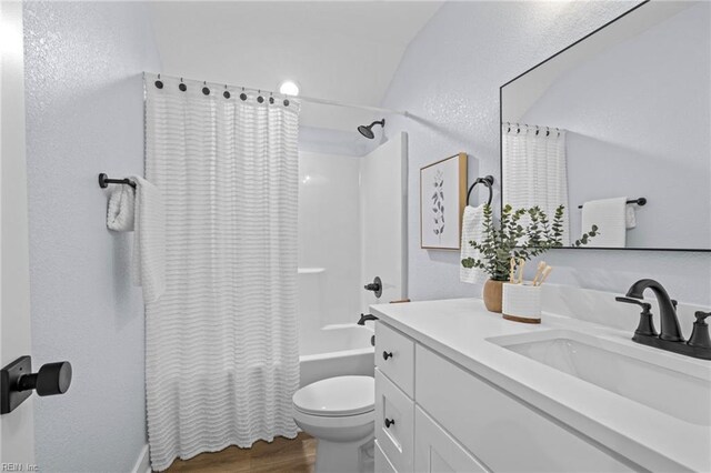 3545 Winston Ave, Virginia Beach, VA 23456 - full bath featuring vanity, toilet, wood finished floors, shower / tub combo, and a textured wall