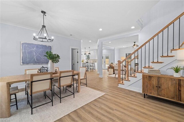 3545 Winston Ave, Virginia Beach, VA 23456 - dining space with crown molding, light wood finished floors, recessed lighting, and stairway