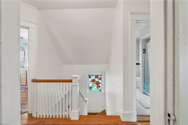stairs featuring baseboards and wood finished floors