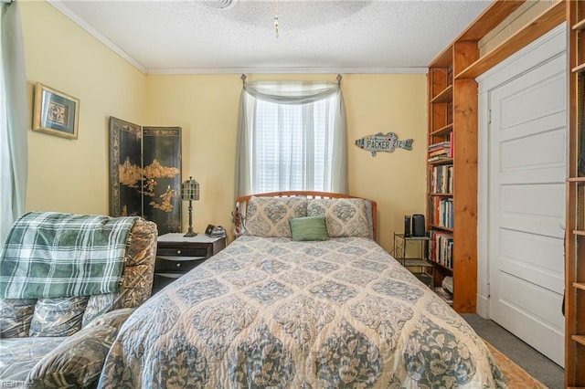 carpeted bedroom with a textured ceiling and ornamental molding