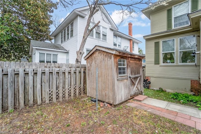 view of shed with fence