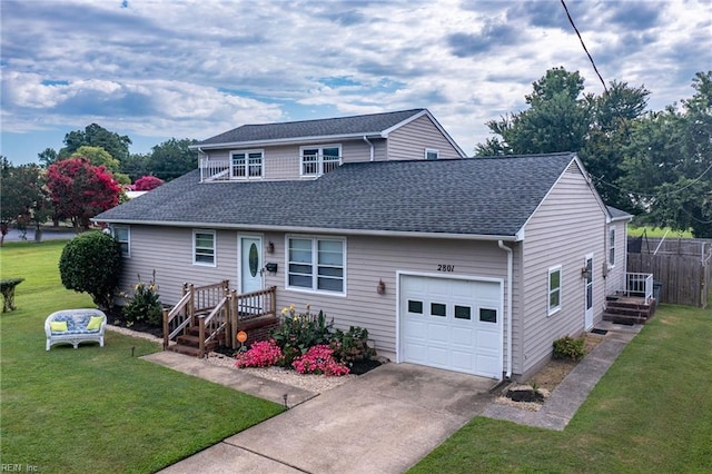 view of front of property with a front yard, a shingled roof, a garage, and concrete driveway