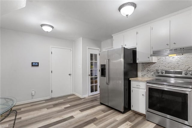 kitchen featuring light wood-type flooring, appliances with stainless steel finishes, under cabinet range hood, light countertops, and backsplash