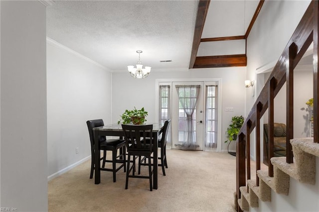 dining room with ornamental molding, light carpet, a chandelier, a textured ceiling, and stairs