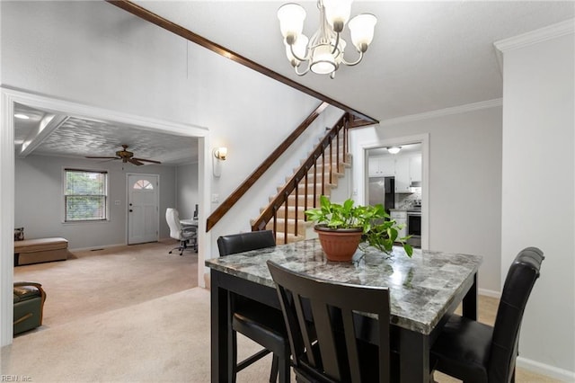 dining area with ornamental molding, baseboards, stairway, and light colored carpet