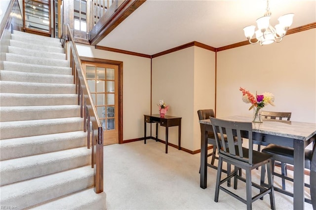 dining room featuring baseboards, an inviting chandelier, crown molding, stairs, and light carpet