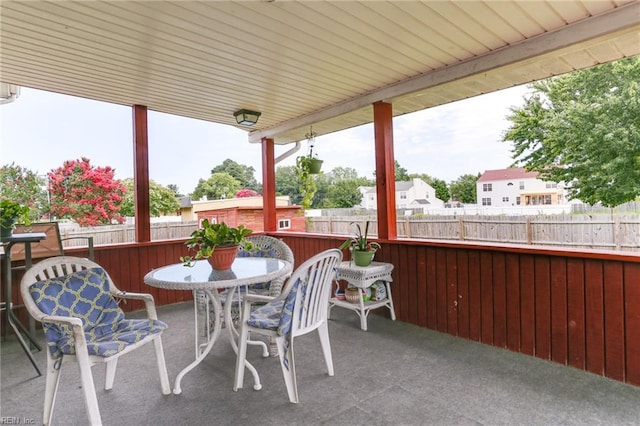 view of patio / terrace with outdoor dining area and fence